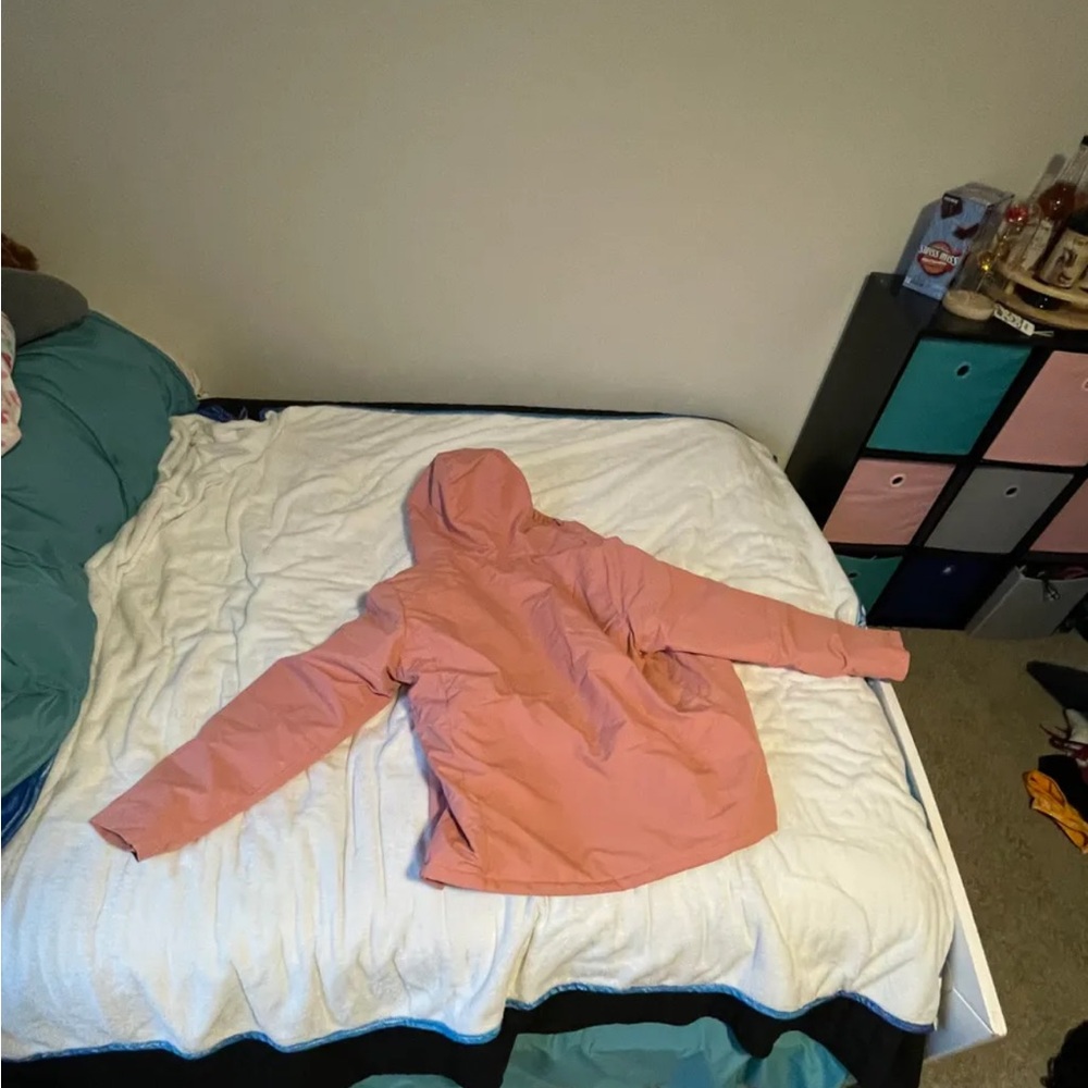 Pink and black jacket.